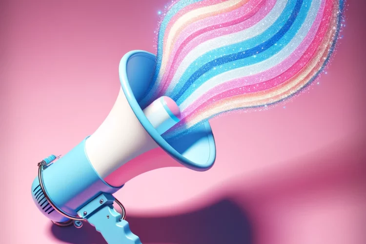 An image of a megaphone painted with the pastel colors of the trans flag baby blue, pink, and white.