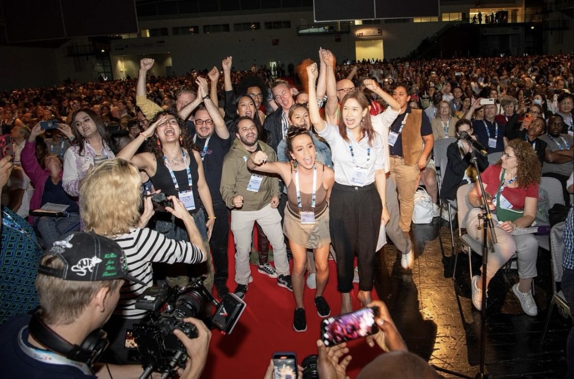 Trans and gender diverse people supporting the intervention at AIDS 2024 when the global trans declaration was shared