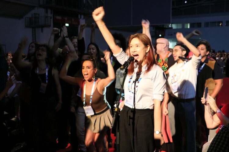 A group of trans activists protesting at the AIDS 2024 conference