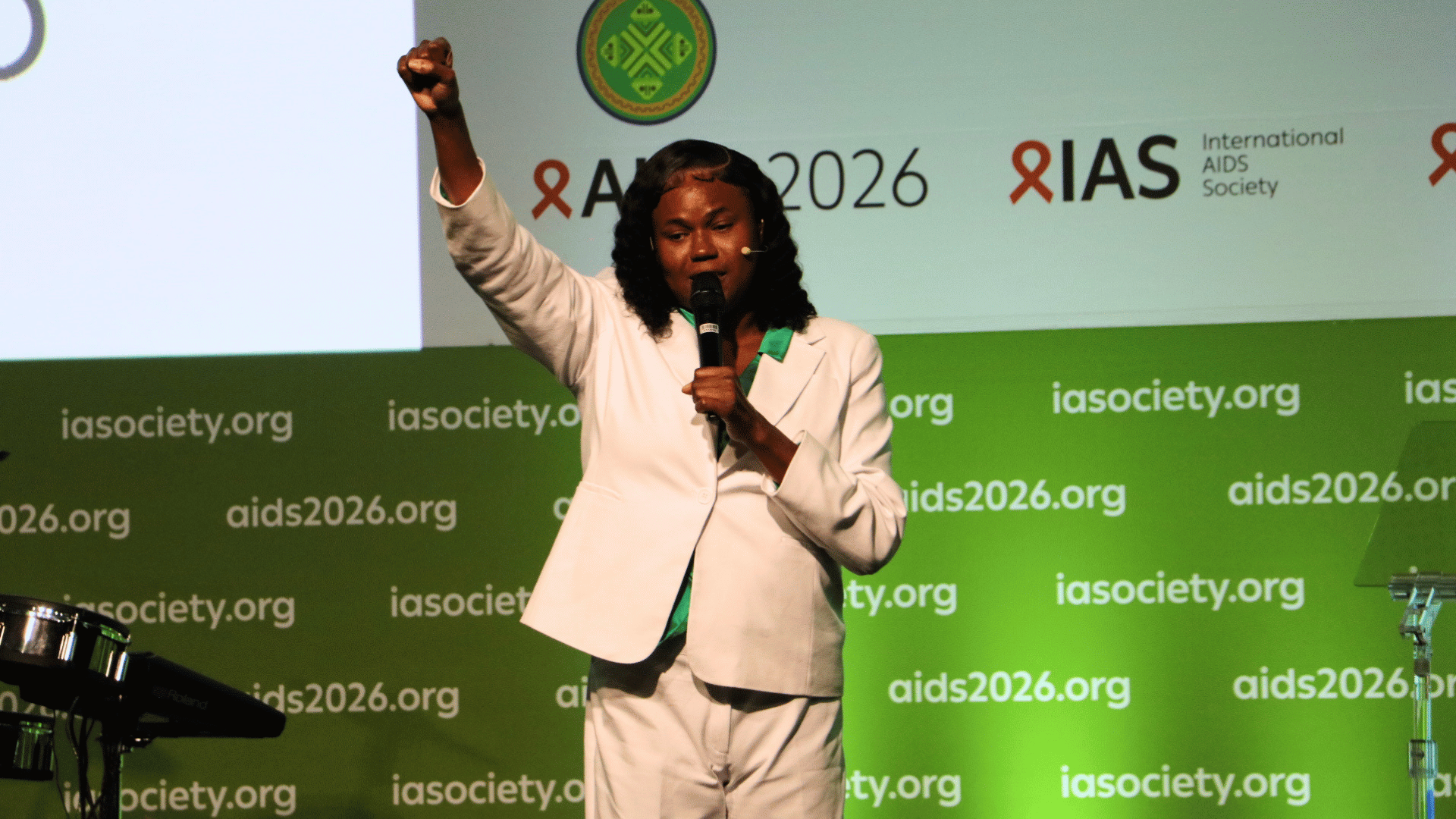 Alexus D'Marco UCtrans on stage at AIDS 2026